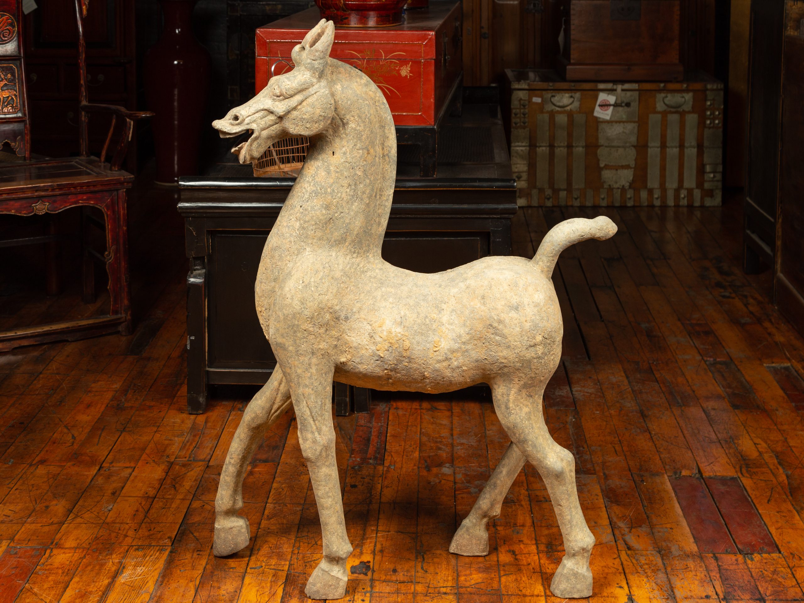 Large horse sculpture photographed in an antiques showroom